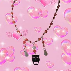Pink Beaded Necklace with Black Mask Pendant